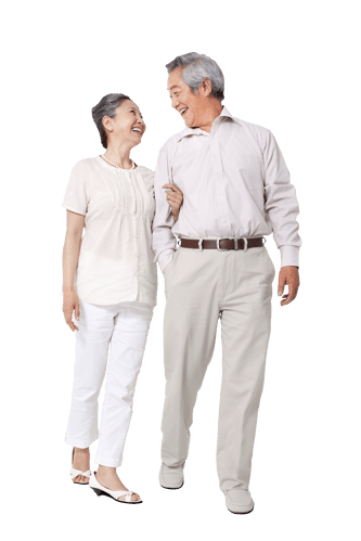 Older Asian couple smiling with their arms linked