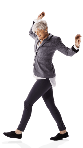 Older woman walking forward and smiling Older woman walking forward and smiling